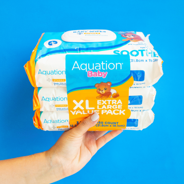 Hand holding Aquation Baby Soothe XL Wipes Value Pack